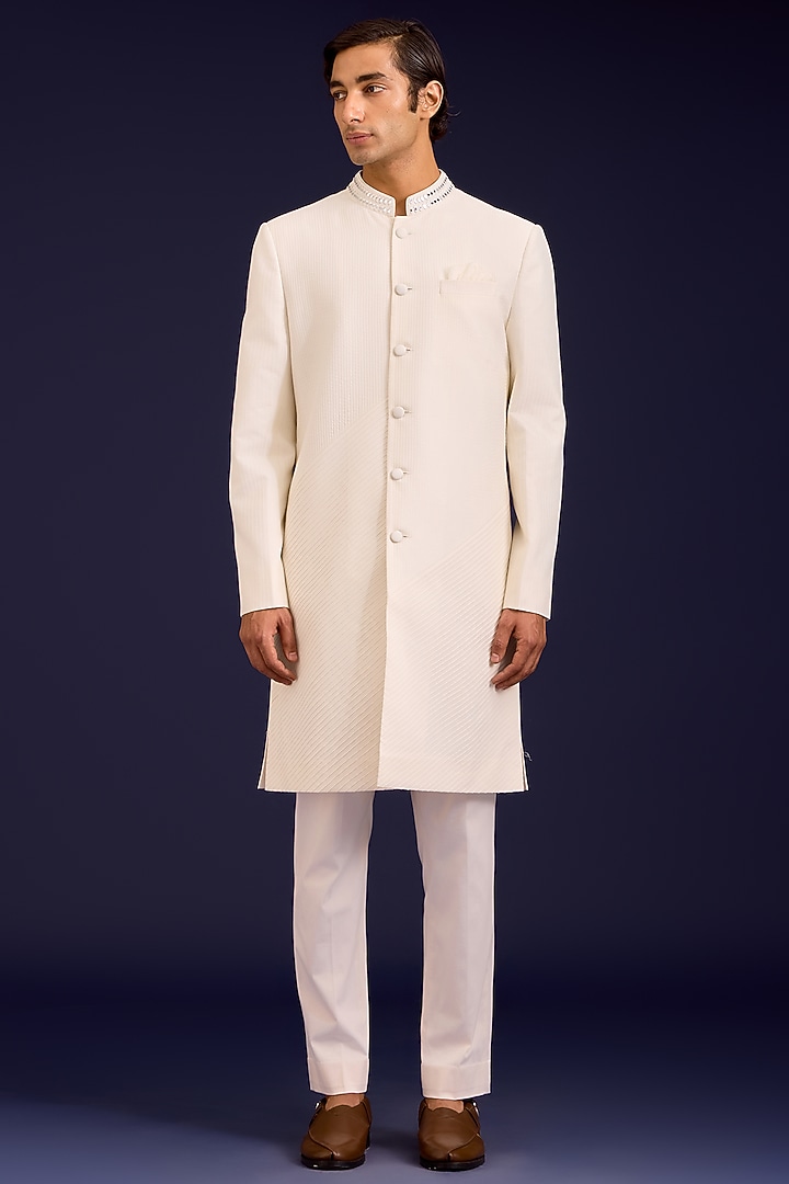 Ivory Cotton Silk Blend Mirror Work Groom Sherwani Set by Devnaagri Men at Pernia's Pop Up Shop