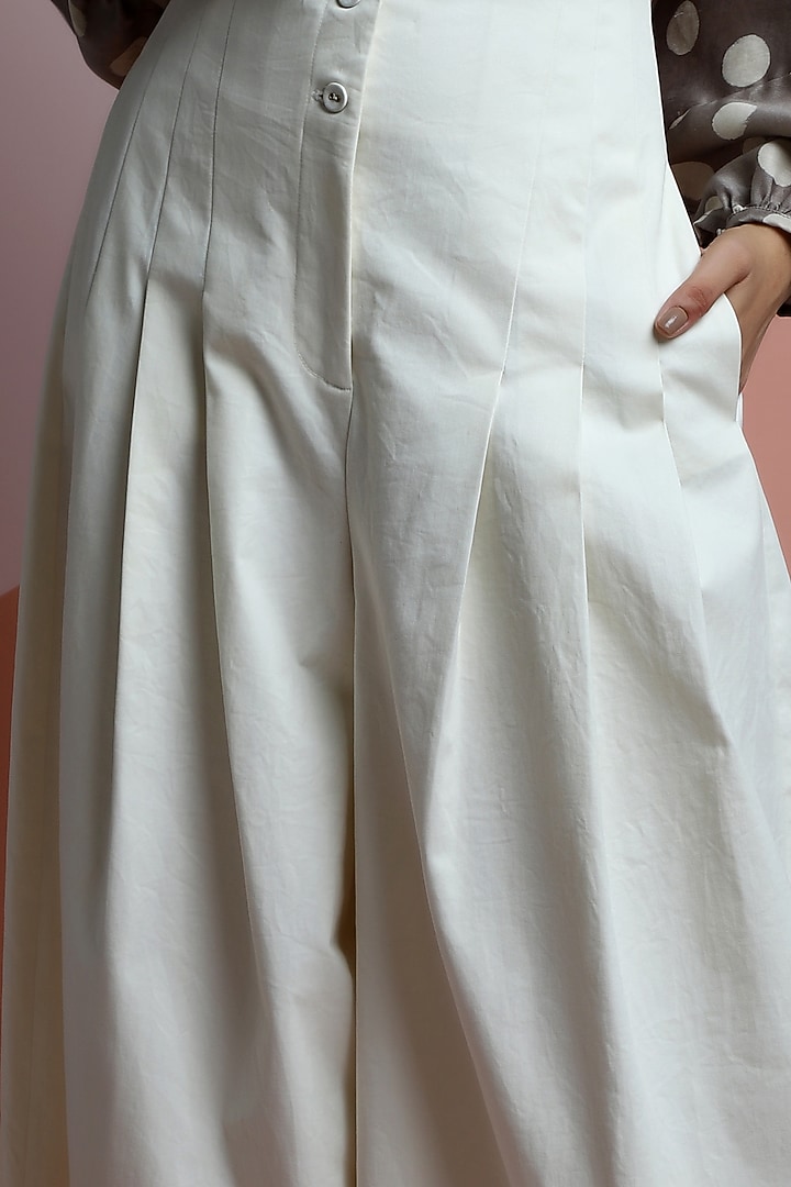 Ceramic White Cotton Twill Flared Pants by DHI at Pernia's Pop Up Shop