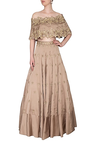 Almond Embroidered Off Shoulder Cape With Bustier & Lehenga Skirt by NIKITA KANODIA GUPTA