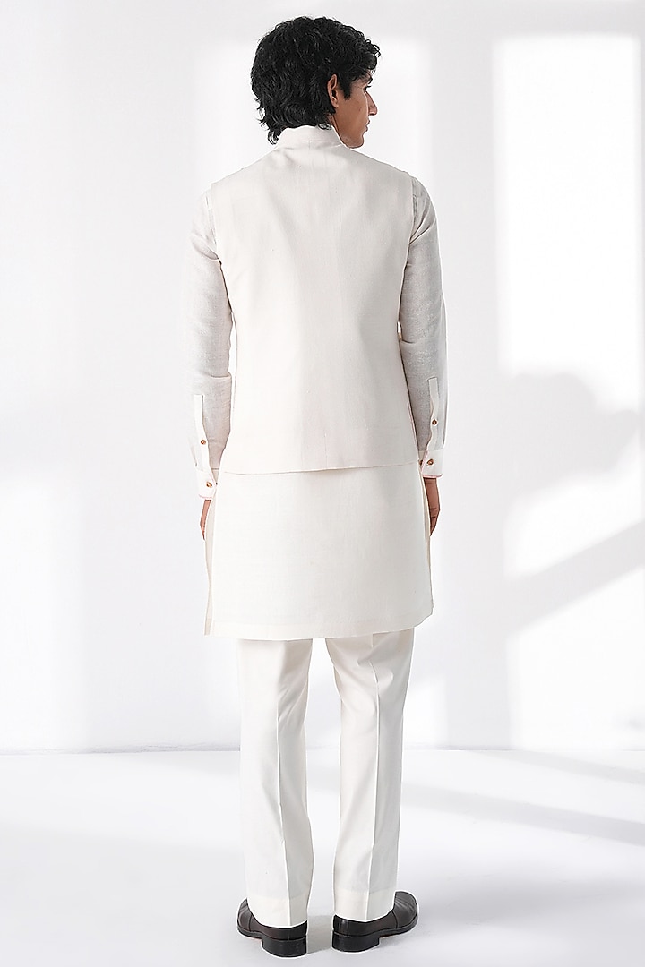 Ivory Silk Thread Embroidered Nehru Jacket by Dhruv Vaish at Pernia's Pop Up Shop
