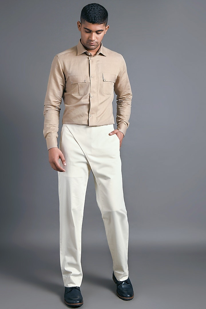 Cream Trousers With Flap Closure by Dhruv Vaish