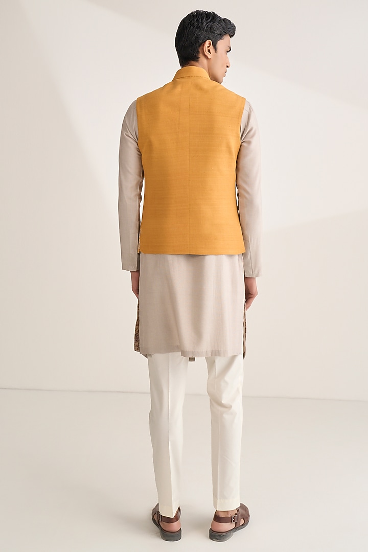 Ochre Silk Embroidered Bundi Jacket by Dhruv Vaish at Pernia's Pop Up Shop