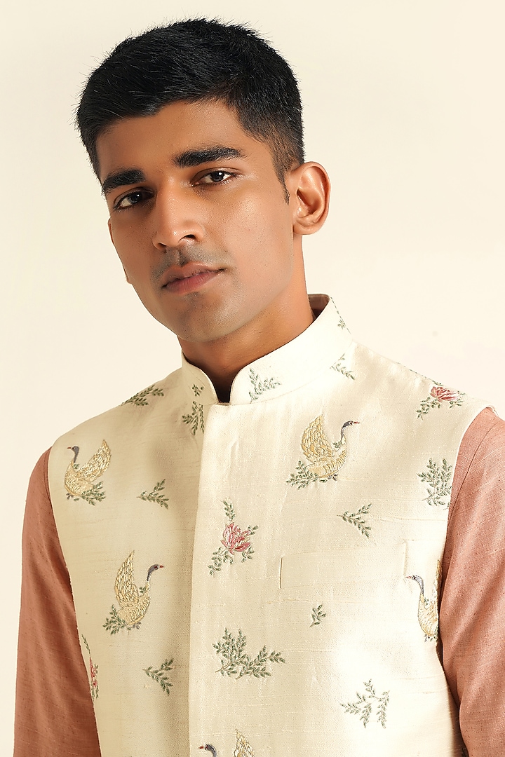 Ivory Silk Thread Embroidered Nehru Jacket by Dhruv Vaish at Pernia's Pop Up Shop