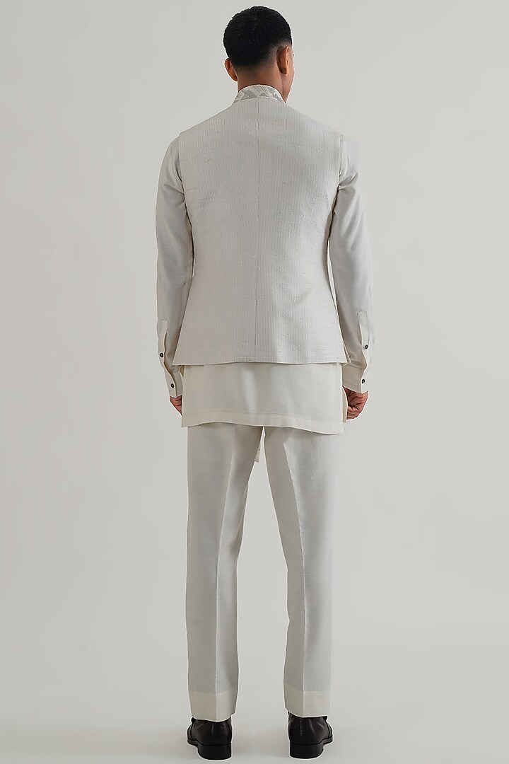 Ivory Silk Criss-Cross Embroidered Nehru Jacket by Dhruv Vaish at Pernia's Pop Up Shop