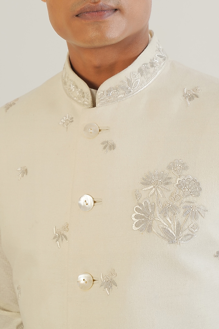 Ivory Silk Floral Motifs Embroidered Nehru Jacket by Dhruv Vaish at Pernia's Pop Up Shop