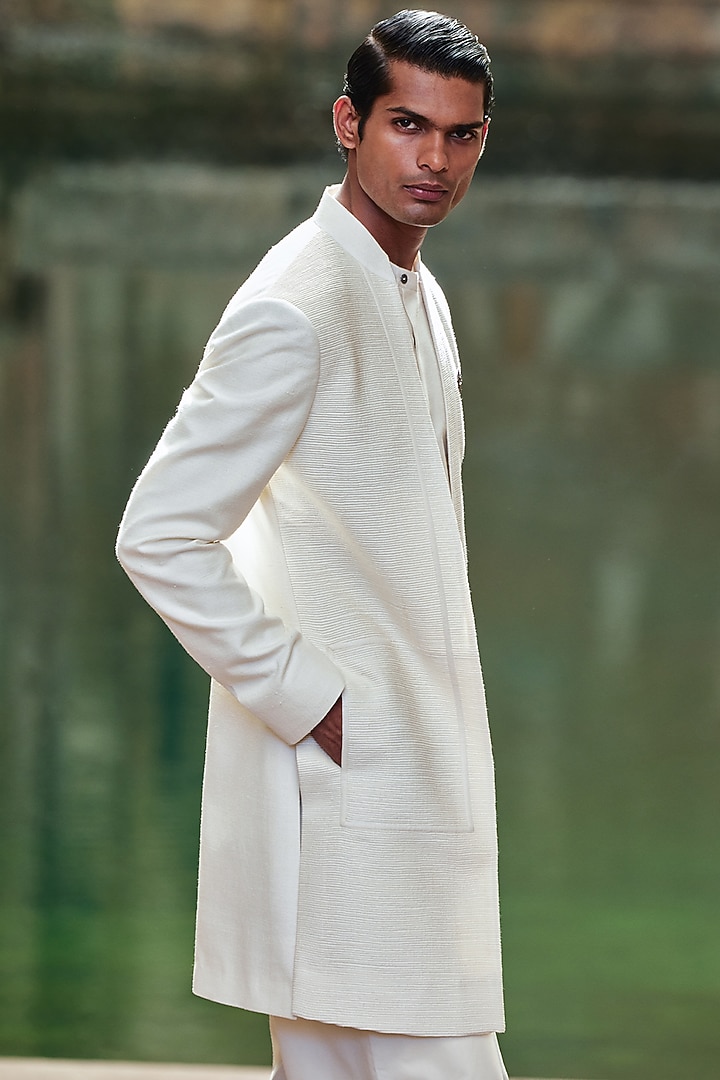 Ivory Silk Pintucks Wedding Sherwani by Dhruv Vaish at Pernia's Pop Up Shop