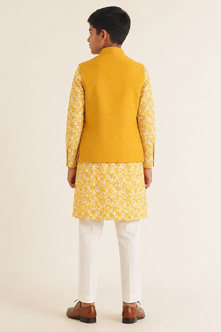 Marigold Yellow Silk Pintuck Nehru Jacket For Boys by Dhruv Vaish Kids at Pernia's Pop Up Shop