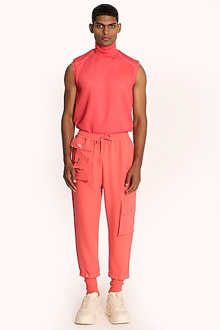 Coral Pink Banana Crepe Jogger Pants by DIERMEISS BY THE DRAGON LADY