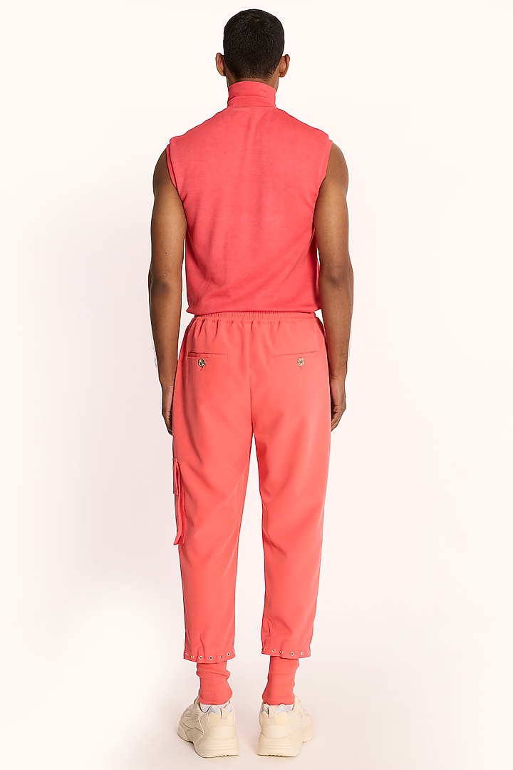 Coral Pink Banana Crepe Jogger Pants by DIERMEISS BY THE DRAGON LADY at Pernia's Pop Up Shop