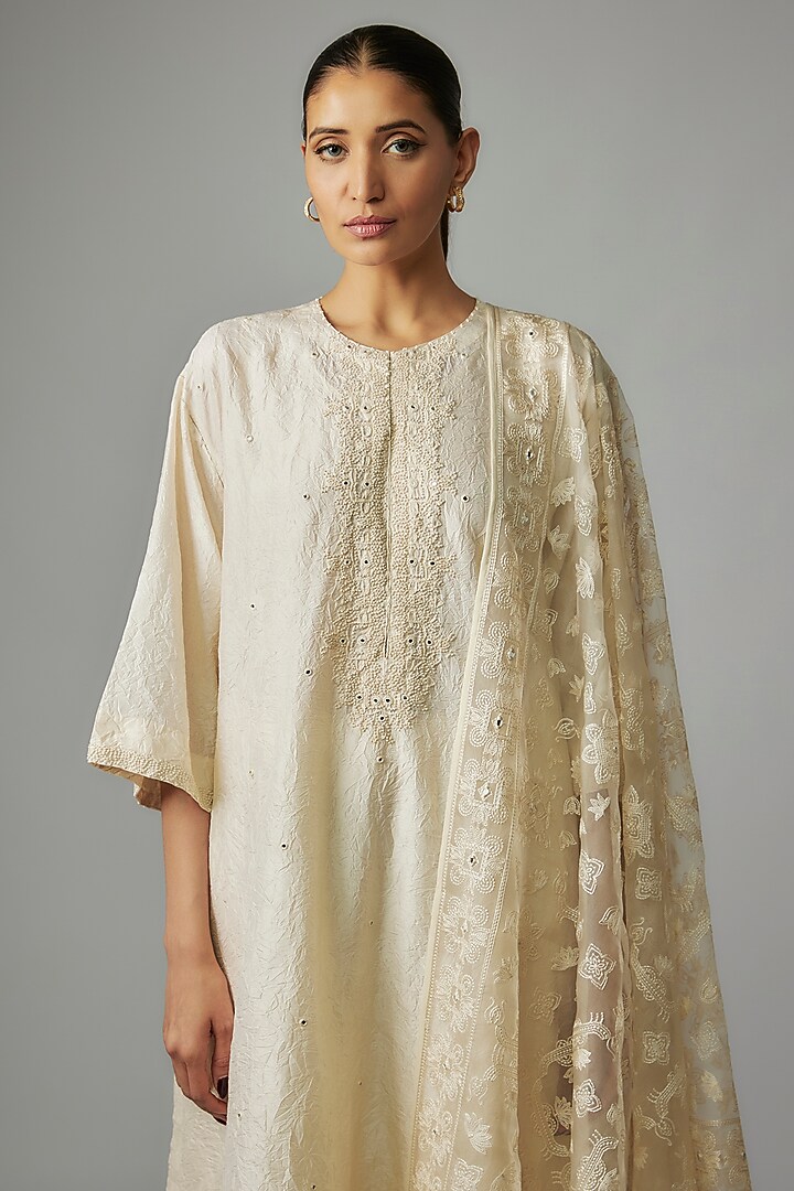 Ivory Mulberry Silk Mirror Embroidered Kurta Set by Divyam Mehta at Pernia's Pop Up Shop
