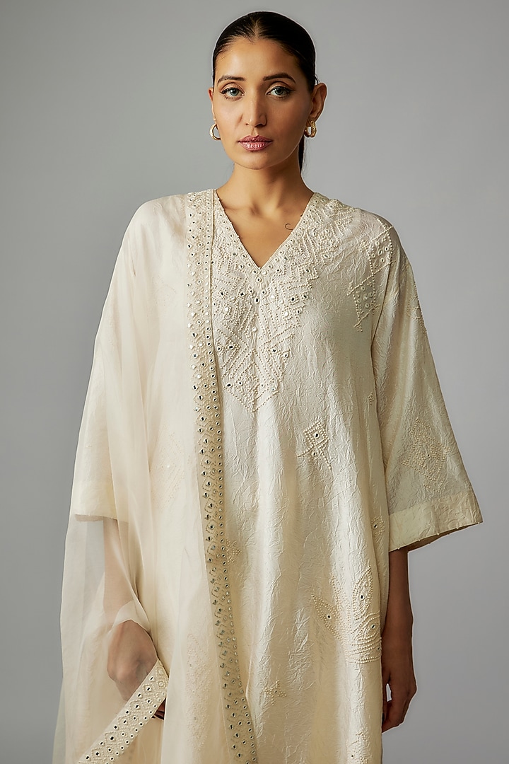 Ivory Mulberry Silk Mirror Embroidered Kurta Set by Divyam Mehta at Pernia's Pop Up Shop