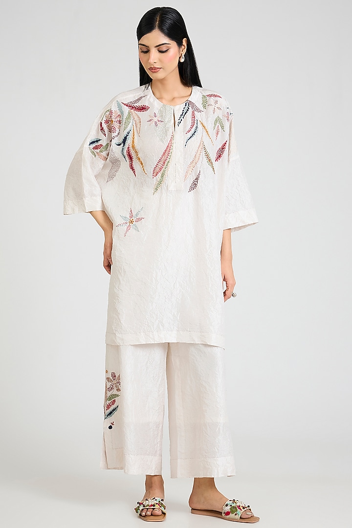 Ivory Mulberry Silk Floral Hand Embroidered Tunic Set by Divyam Mehta at Pernia's Pop Up Shop