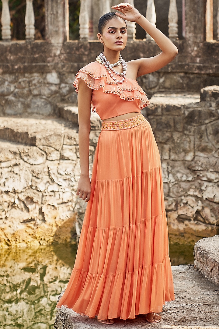 Orange Tiered Skirt Set With Embroidered Belt by DISHA MUCHHALA