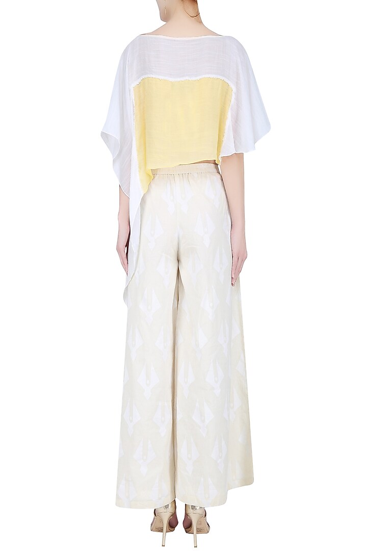 Mango yellow and ivory asymmetric hem crop top available only at Pernia's Pop Up Shop.