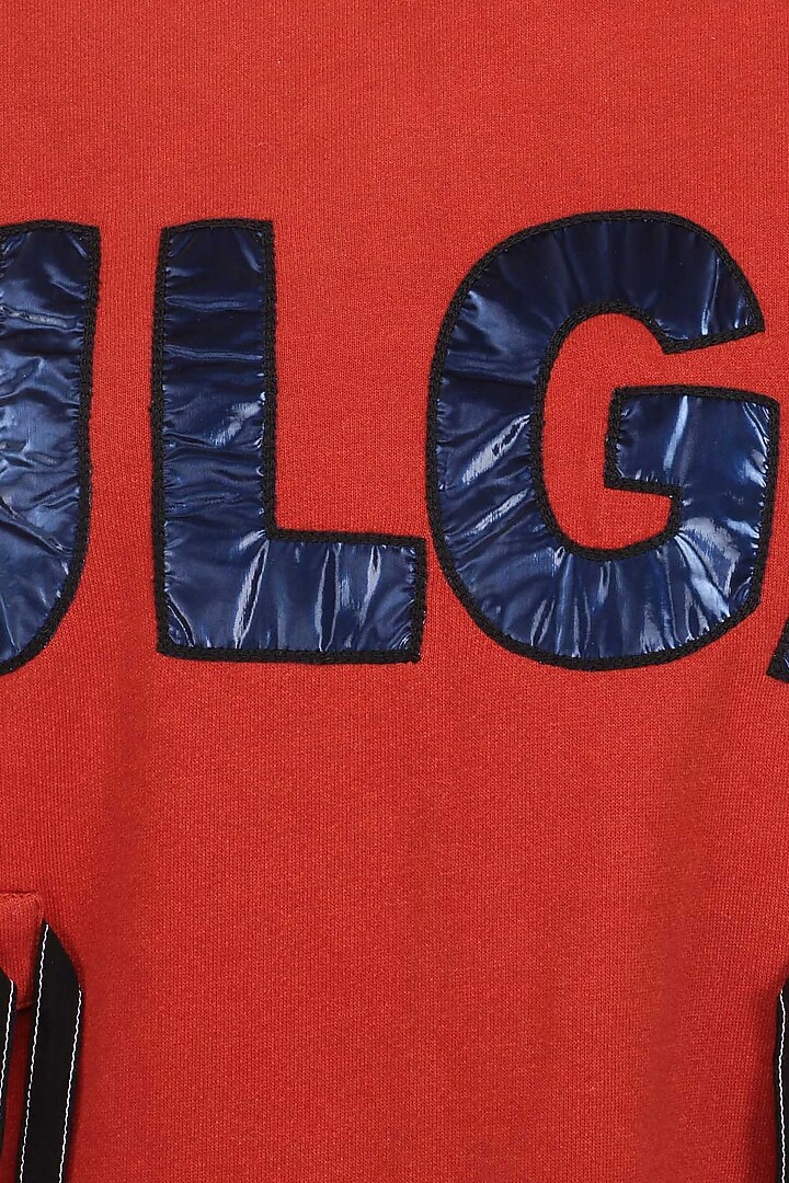 Orange 'VULGAR' text jumper available only at Pernia's Pop Up Shop.