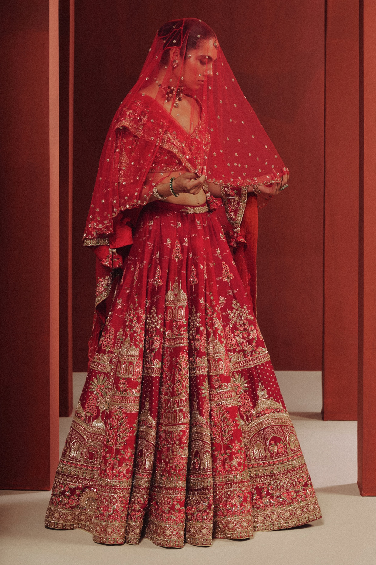 Dolly J Deep Red Raw Silk Motifs Embroidered Bridal Lehenga Set