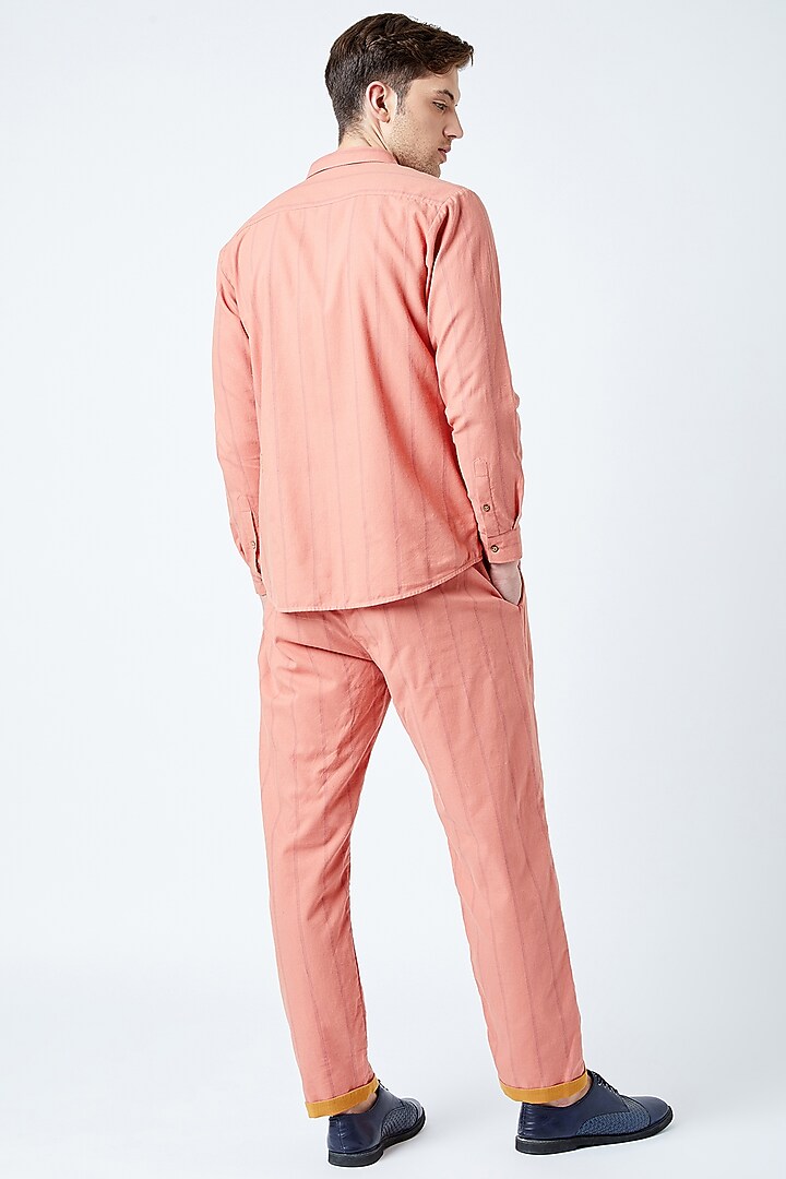 Peach Printed & Embroidered Pants by Doodlage Men at Pernia's Pop Up Shop