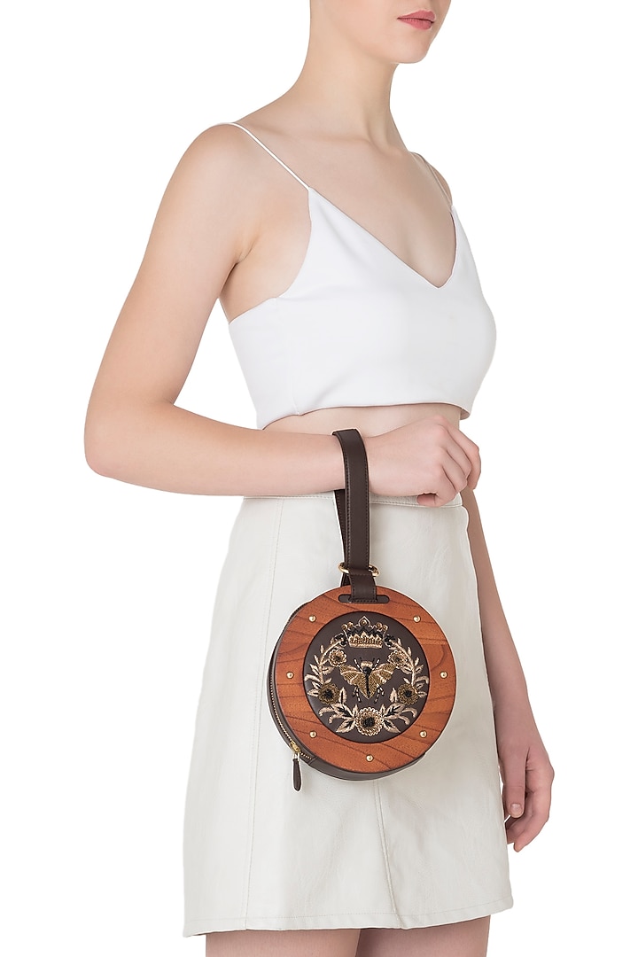 Brown and orange circular embroidered clutch available only at Pernia's Pop Up Shop.