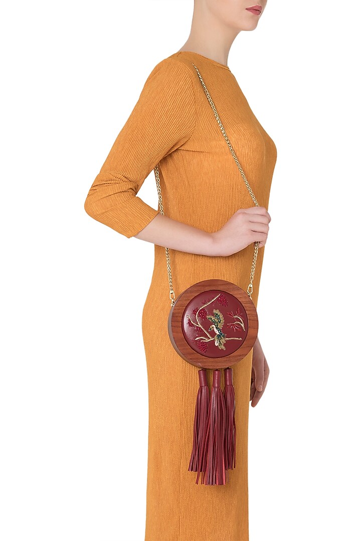 Red embroidered multi tassel clutch available only at Pernia's Pop Up Shop.