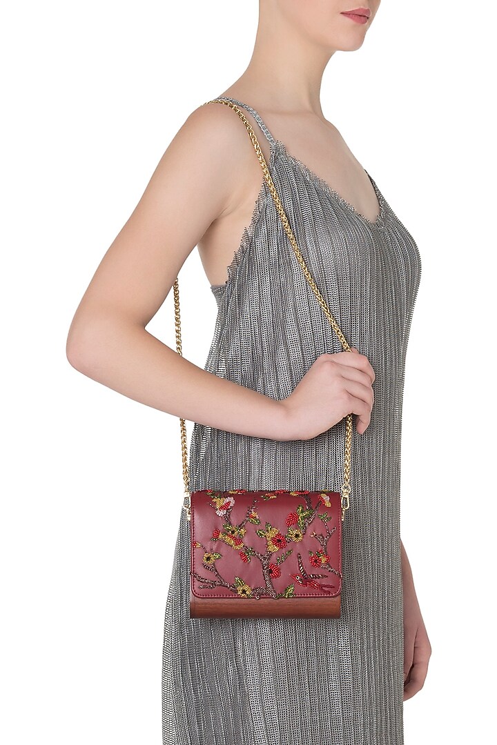 Red embroidered flapover clutch available only at Pernia's Pop Up Shop.