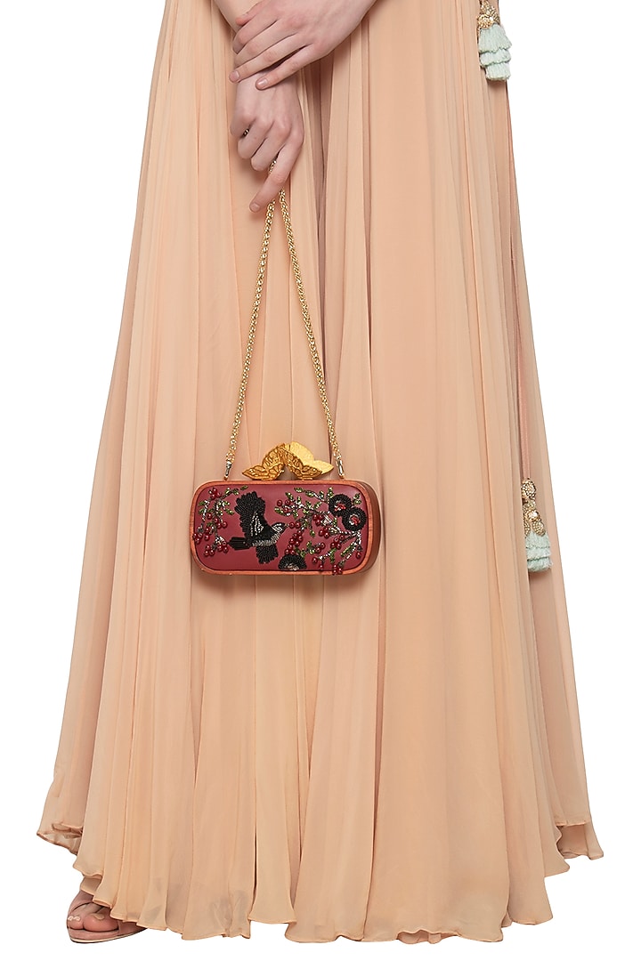Red embroidered clutch bag by Duet Luxury at Pernia's Pop Up Shop