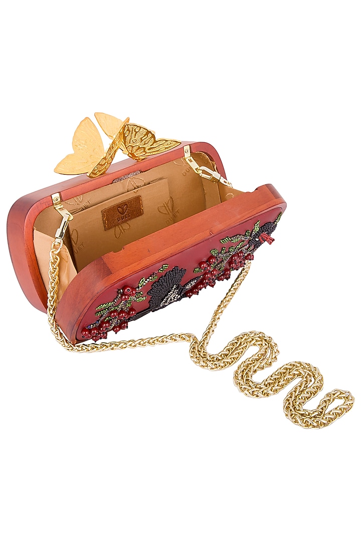 Red embroidered clutch bag by Duet Luxury at Pernia's Pop Up Shop