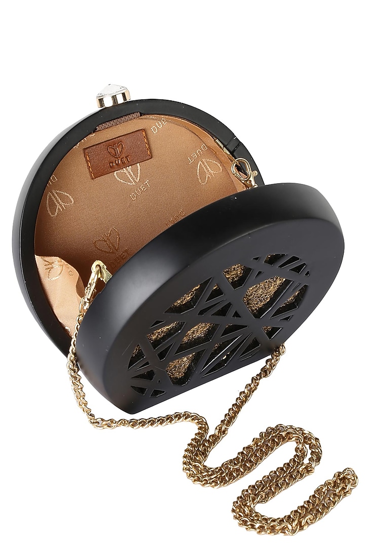 Duet luxury presents Black round box clutch with gold sequins insert available only at Pernia's Pop Up Shop.
