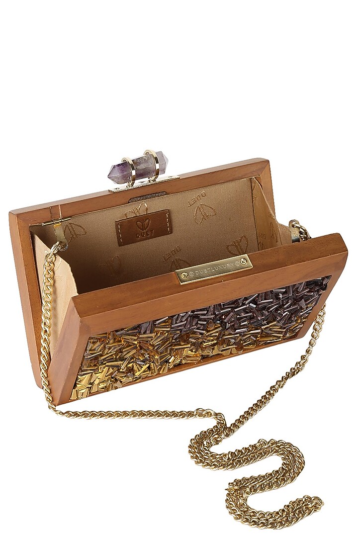 Duet luxury presents Walnut frame gold, brown and purple crystals embellished rectangle clutch available only at Pernia's Pop Up Shop.