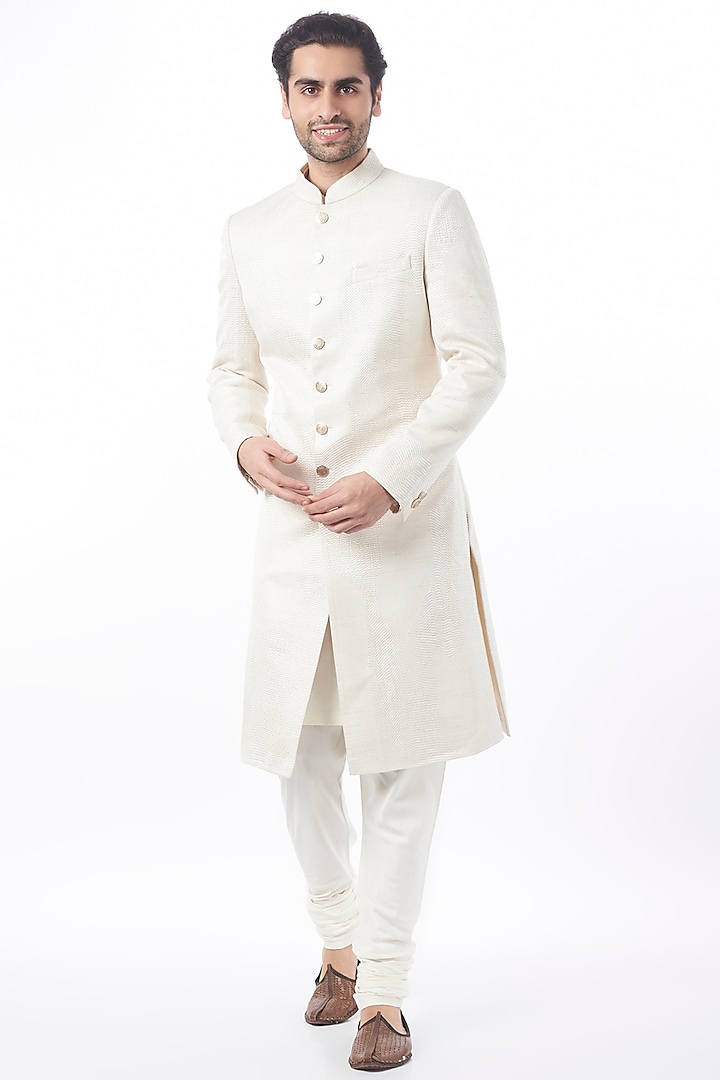 Ivory Sherwani Set In Raw Silk by Divyam Mehta Men