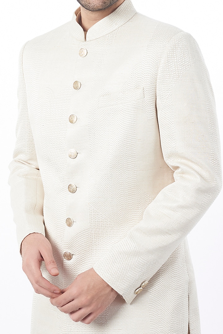 Ivory Raw Silk Groom Sherwani Set by Divyam Mehta Men at Pernia's Pop Up Shop