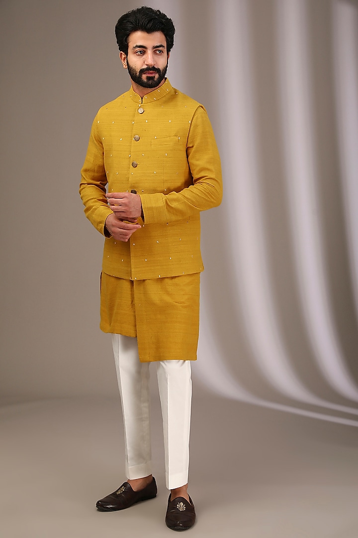 Yellow Raw Silk Bundi Jacket Set by Divyam Mehta Men