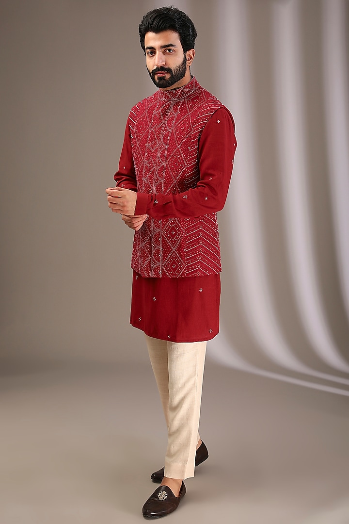 Red Raw Silk Embroidered Bundi Jacket Set by Divyam Mehta Men