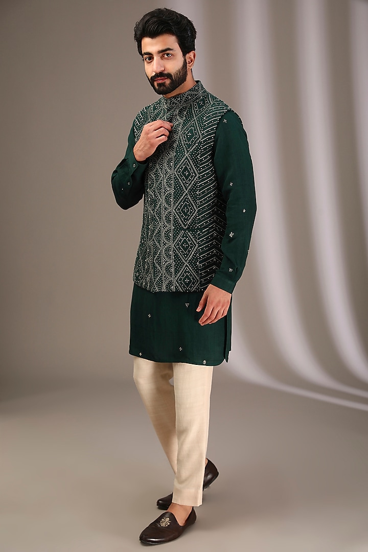 Bottle Green Raw Silk Embroidered Bundi Jacket Set by Divyam Mehta Men