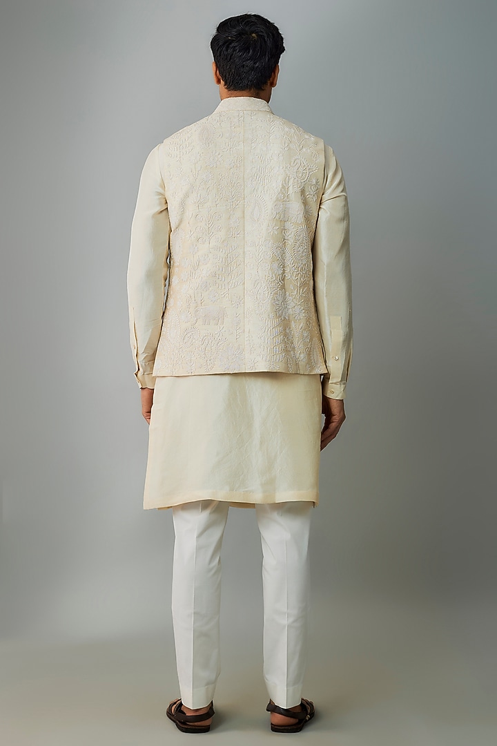 Ivory Raw Silk Embroidered Bundi Jacket Set by Divyam Mehta Men at Pernia's Pop Up Shop