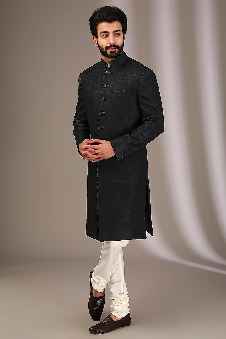 Black Raw Silk Sherwani Set by Divyam Mehta Men