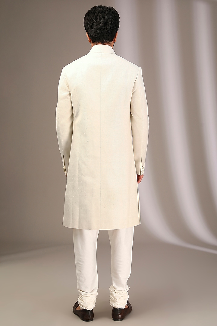 Ivory Raw Silk Wedding Sherwani Set by Divyam Mehta Men at Pernia's Pop Up Shop