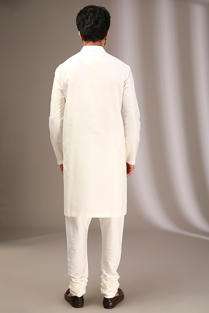 Ivory Raw Silk Wedding Sherwani Set by Divyam Mehta Men at Pernia's Pop Up Shop