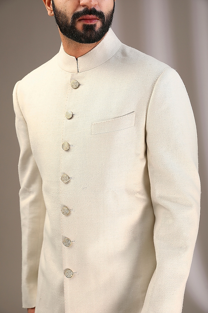Ivory Raw Silk Wedding Sherwani Set by Divyam Mehta Men at Pernia's Pop Up Shop