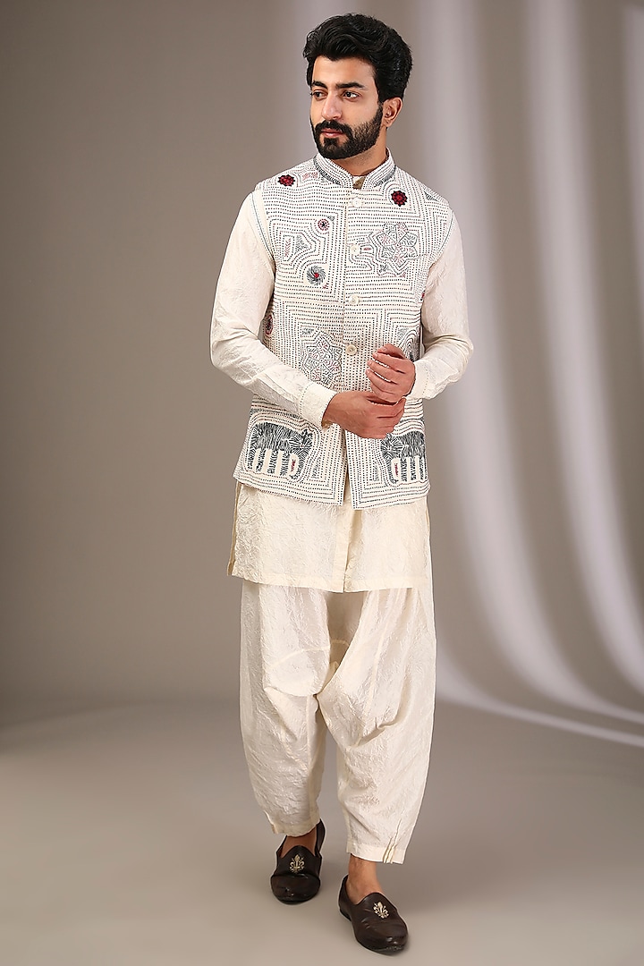 Ivory Raw Silk Bundi Jacket Set by Divyam Mehta Men