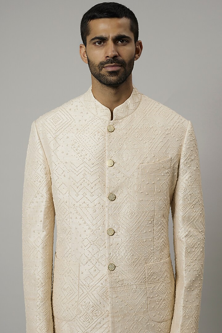 Ivory Raw Silk Groom Bandhgala Set by Divyam Mehta Men at Pernia's Pop Up Shop