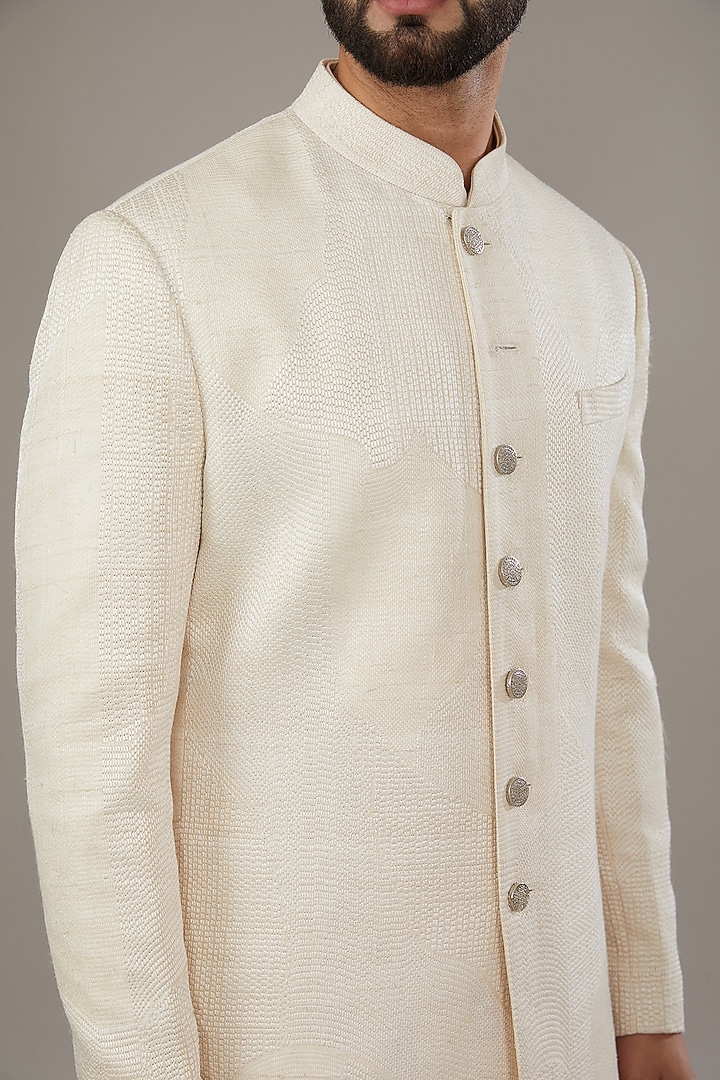 Ivory Raw Silk Groom Sherwani Set by Divyam Mehta Men at Pernia's Pop Up Shop