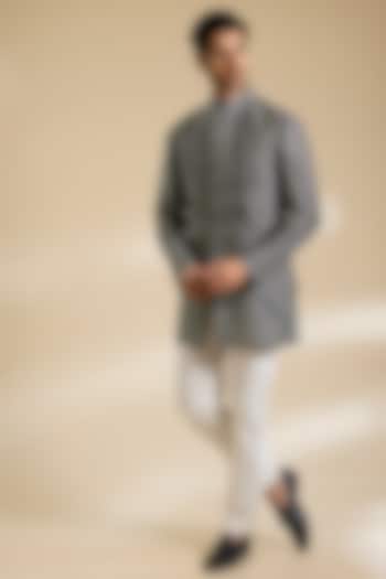 Coal Black Raw Silk Bundi Jacket Set by Divyam Mehta Men