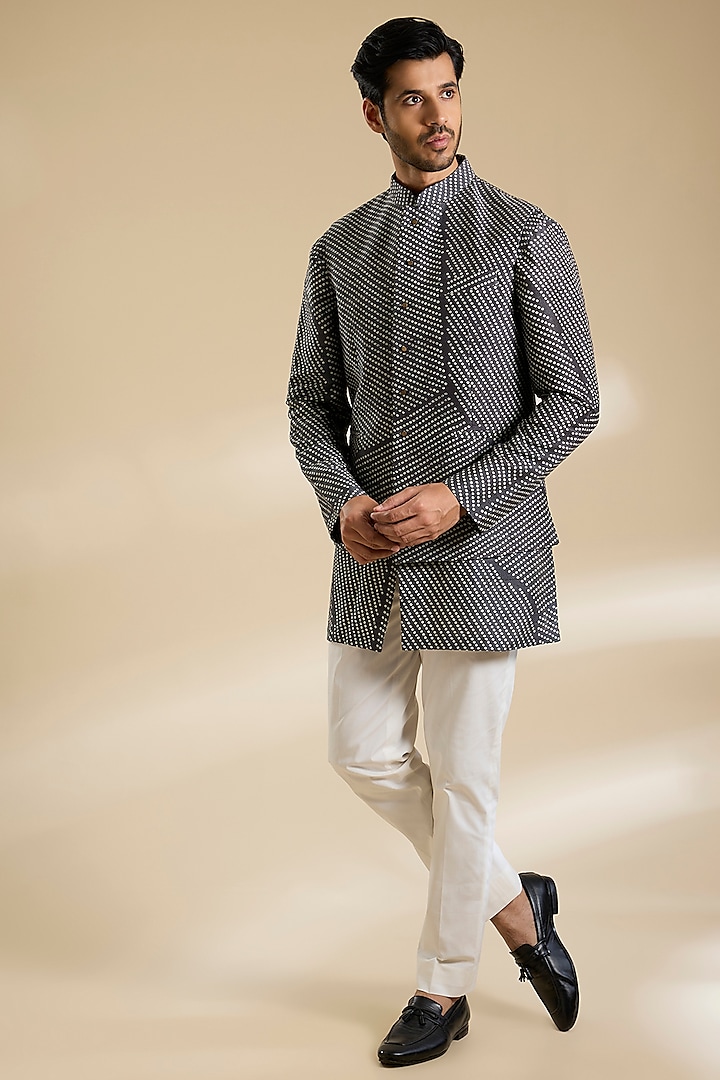 Coal Black Raw Silk Bundi Jacket Set by Divyam Mehta Men