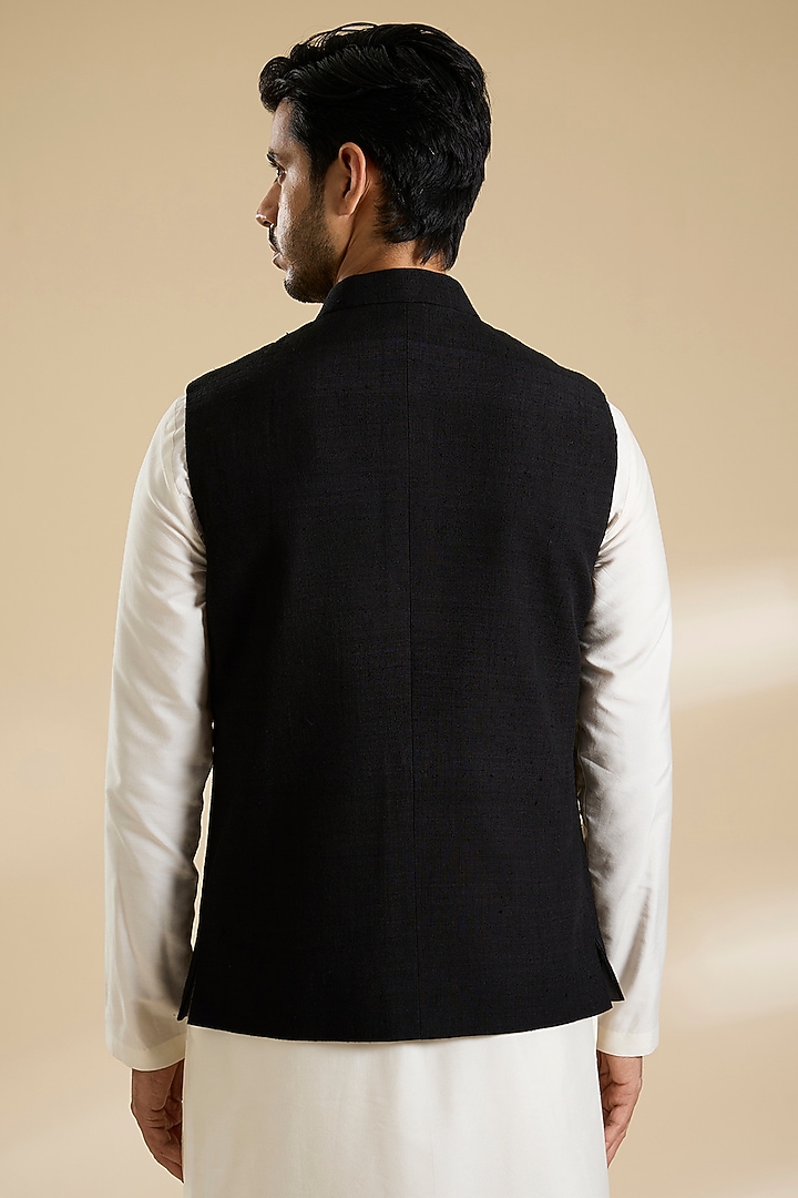 Black Raw Silk Bundi Jacket by Divyam Mehta Men at Pernia's Pop Up Shop