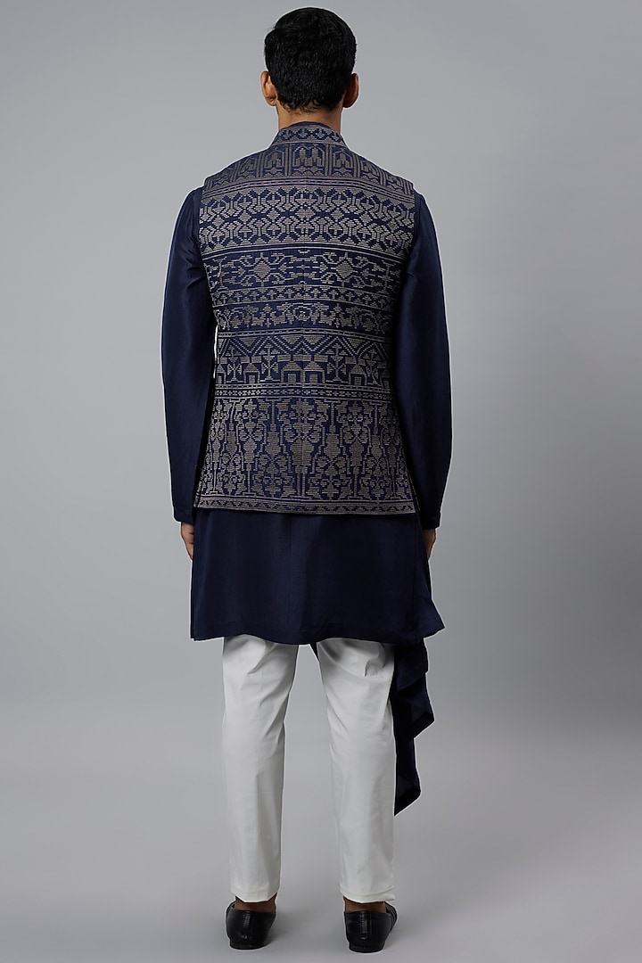 Blue Raw Silk Bundi Jacket Set by Divyam Mehta Men at Pernia's Pop Up Shop