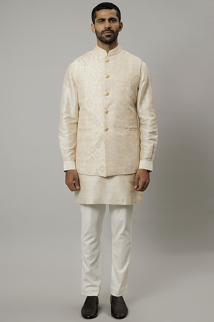 Ivory Raw Silk Embroidered Bundi Jacket Set by Divyam Mehta Men at Pernia's Pop Up Shop