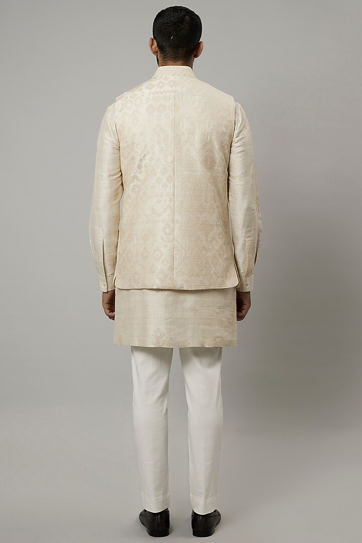 Ivory Raw Silk Embroidered Bundi Jacket Set by Divyam Mehta Men at Pernia's Pop Up Shop