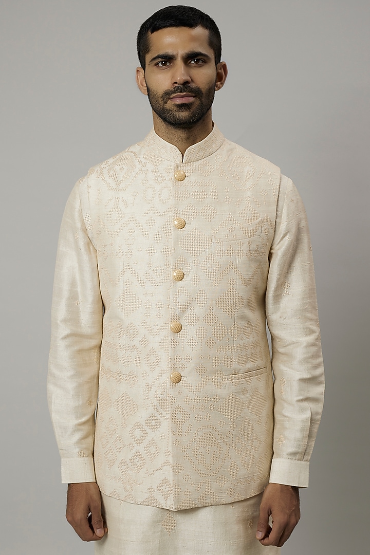 Ivory Raw Silk Embroidered Bundi Jacket Set by Divyam Mehta Men at Pernia's Pop Up Shop