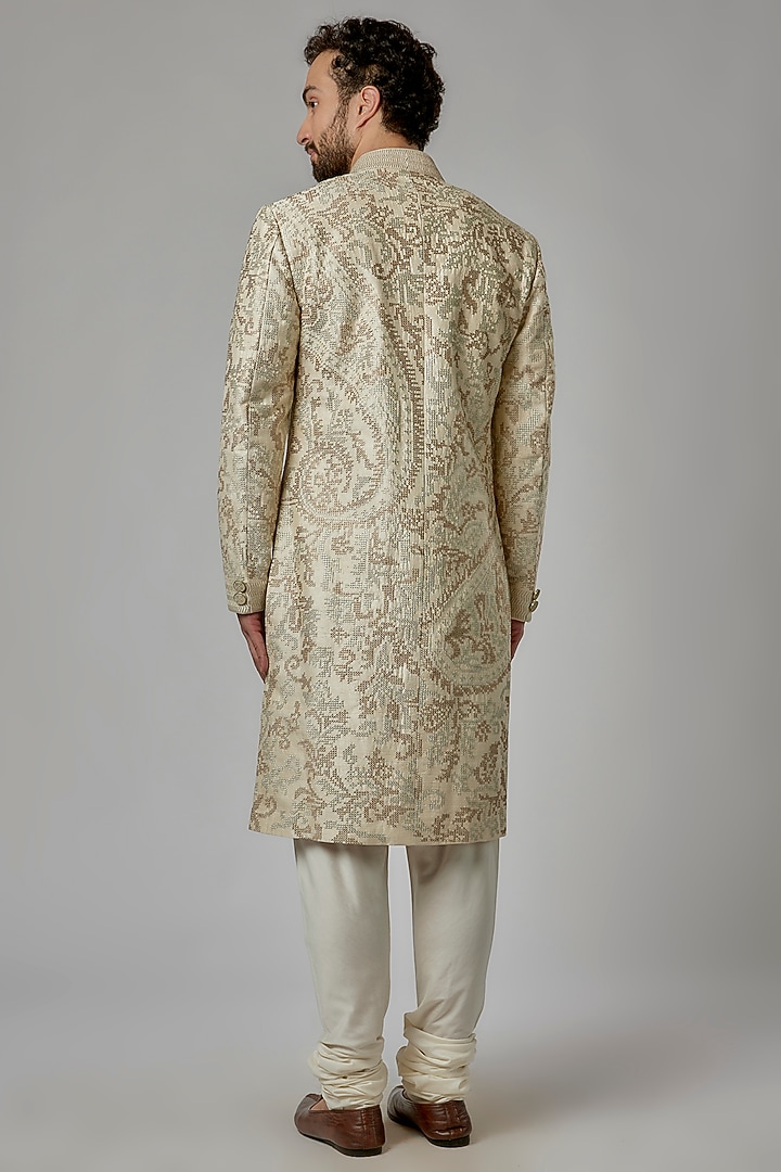 Ivory Raw Silk Groom Sherwani Set by Divyam Mehta Men at Pernia's Pop Up Shop