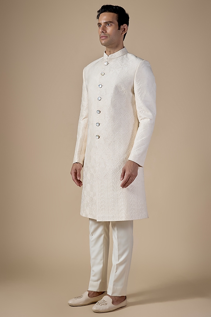Ivory Raw Silk Groom Sherwani Set by Divyam Mehta Men at Pernia's Pop Up Shop